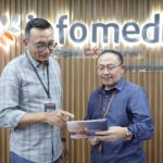 Andri Wibawanto - Direktur Solution and Business Development Infomedia (kiri) dan Sujito, Direktur Marketing & Sales Infomedia. Foto: Telkom Indonesia