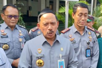 Kepala Kanwilkumham DKI Jakarta, Ibnu Chuldun (tengah) dan jajaran Kemenkumham di Jakarta. Foto: Dok/ipol.id