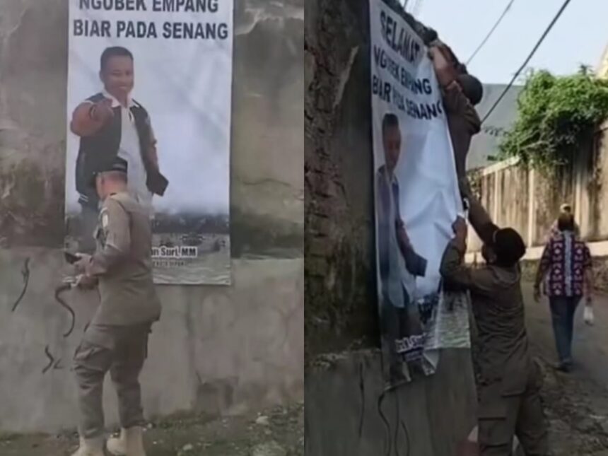 Oknum Satpol PP Depok lakukan pencopotan spanduk Sekda Supian Suri di acara Ngubek Empang. Foto: IG, @infodepok_id (tangkap layar)