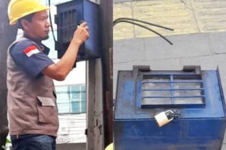 Petugas PLN mencabut KWH Meter milik pedagang di Jalan Gajah Mada Kota Medan. Foto: Instagram @dishub_medan