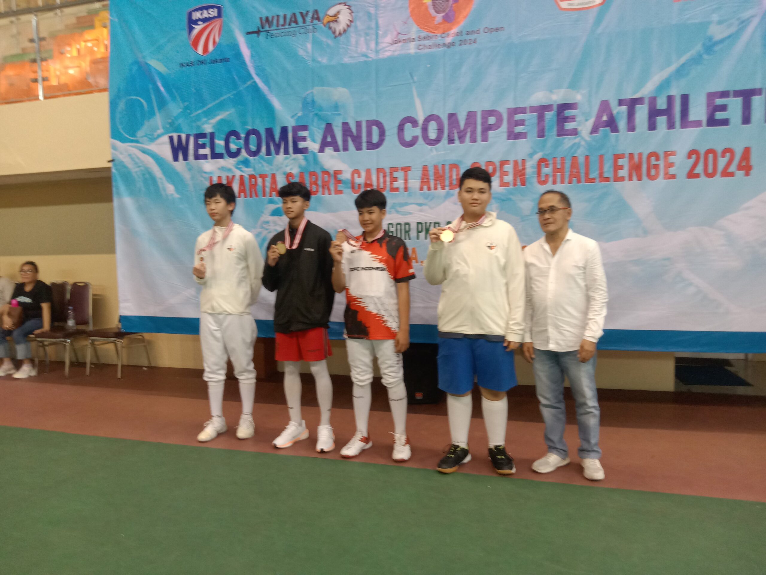 Pengurus Provinsi Ikatan Anggar Seluruh Indonesia (Pengrov IKASI) DKI Jakarta dalam menggelar kompetisi anggar Jakarta Sabre Cadet and Open Challenge 2024 yang dilaksanakan pada 20 Juli 2024 di GOR PKP Ciracas.