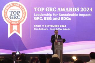 M Lutfi Handayani saat memberi sambutan dalam Top GRC Award 2024. Foto: topbusiness