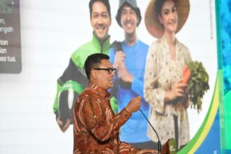 Direktur Utama BPJS Ketenagakerjaan Anggoro Eko Cahyo saat memberikan kata sambutan membuka acara Social Security Summit 2024 di Hotel Bidakara, Pancoran, Jaksel, Selasa (26/11/2024). Foto: BPJS Ketenagakerjaan