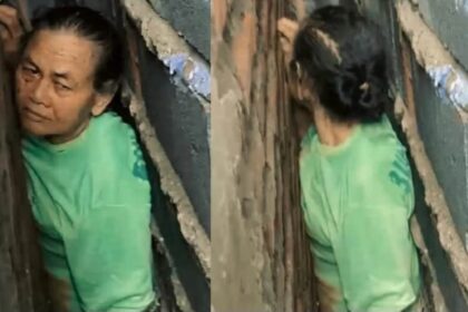 Nenek di Gresik terjepit di celah sempit antara dua bangunan rumah. Foto: Tangkapan layar Instagram @damkarla.gresik