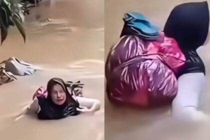 Bidan Dona Lubis seberangi Sungai Batang Pasaman untuk mengobati pasien di Kejorongan Sinuangon, Nagari Cubadak Barat, Kecamatan Dua Koto, Kabupaten Pasaman. Foto: Tangkapan layar TikTok @kaba.pasaman