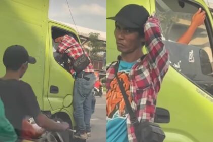 Seorang pria diduga preman memaksa masuk kabin truk saat meminta uang di Cakung, Jaktim. Foto: Tangkap layar IG @jakut.info