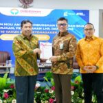 Penandatanganan nota kesepahaman BPJS Ketenagakerjaan dengan Ombudsman RI. (dok. BPJS Ketenagakerjaan)