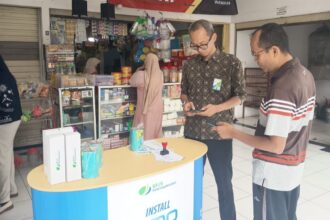 LAYANAN: Salah satu booth Kantor Cabang BPJS Ketenagakerjaan Rawamangun di pasar tradisional. (foto BPJS Ketenagakerjaan)