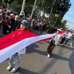 Bendera Merah Putih terbentang di Karnaval Paskah Kota Semarang. Foto: Ist